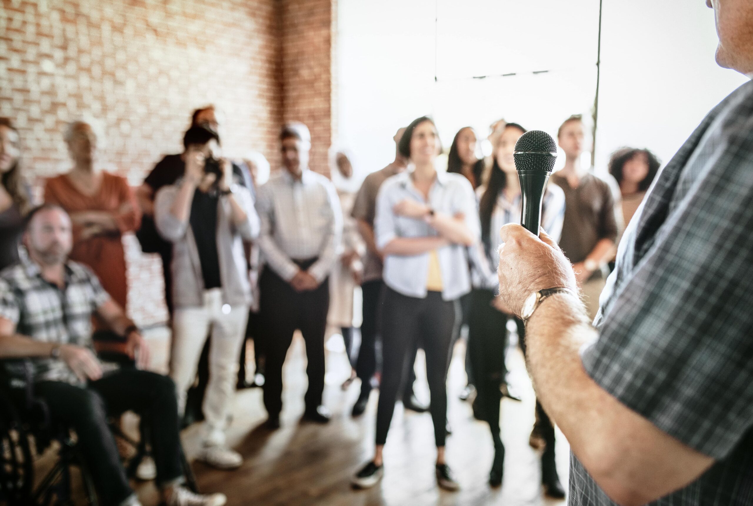 Presenter speaking confidently on stage