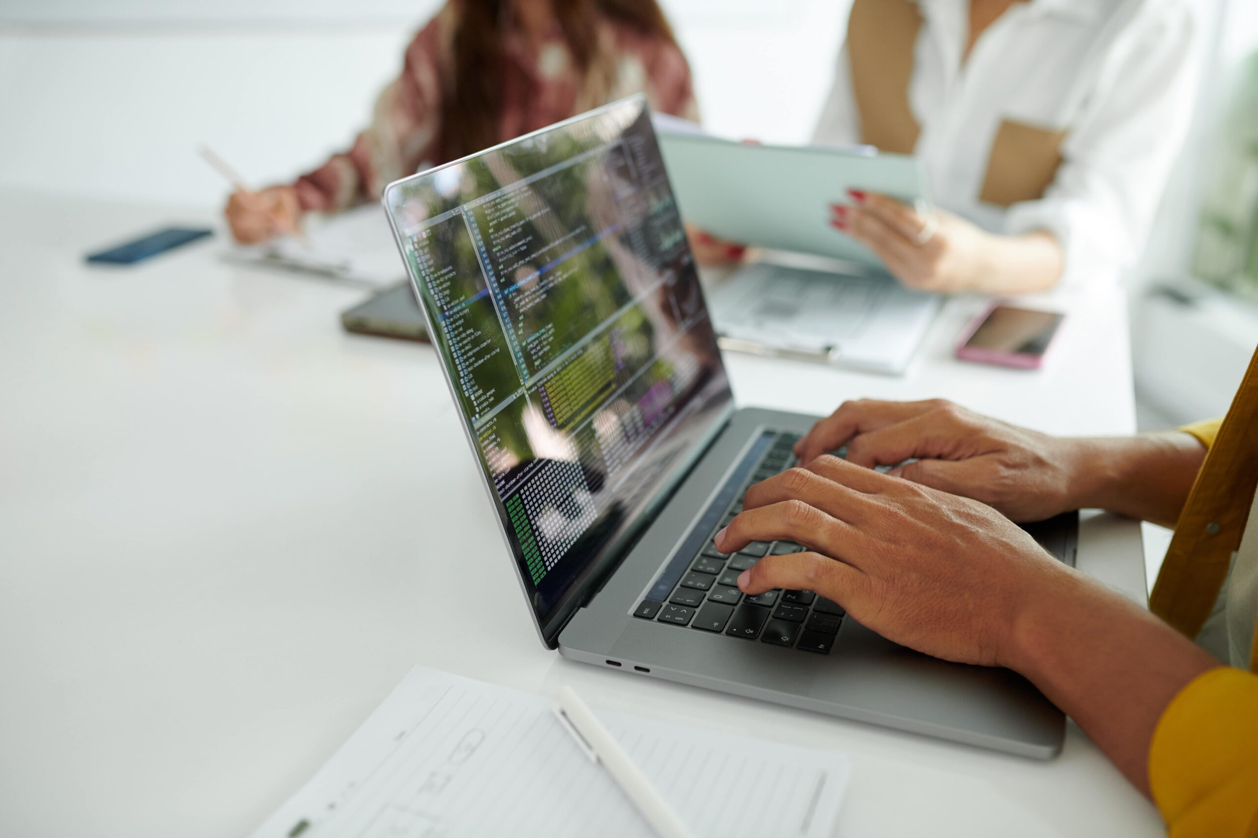 Woman typing on a laptop keyboard